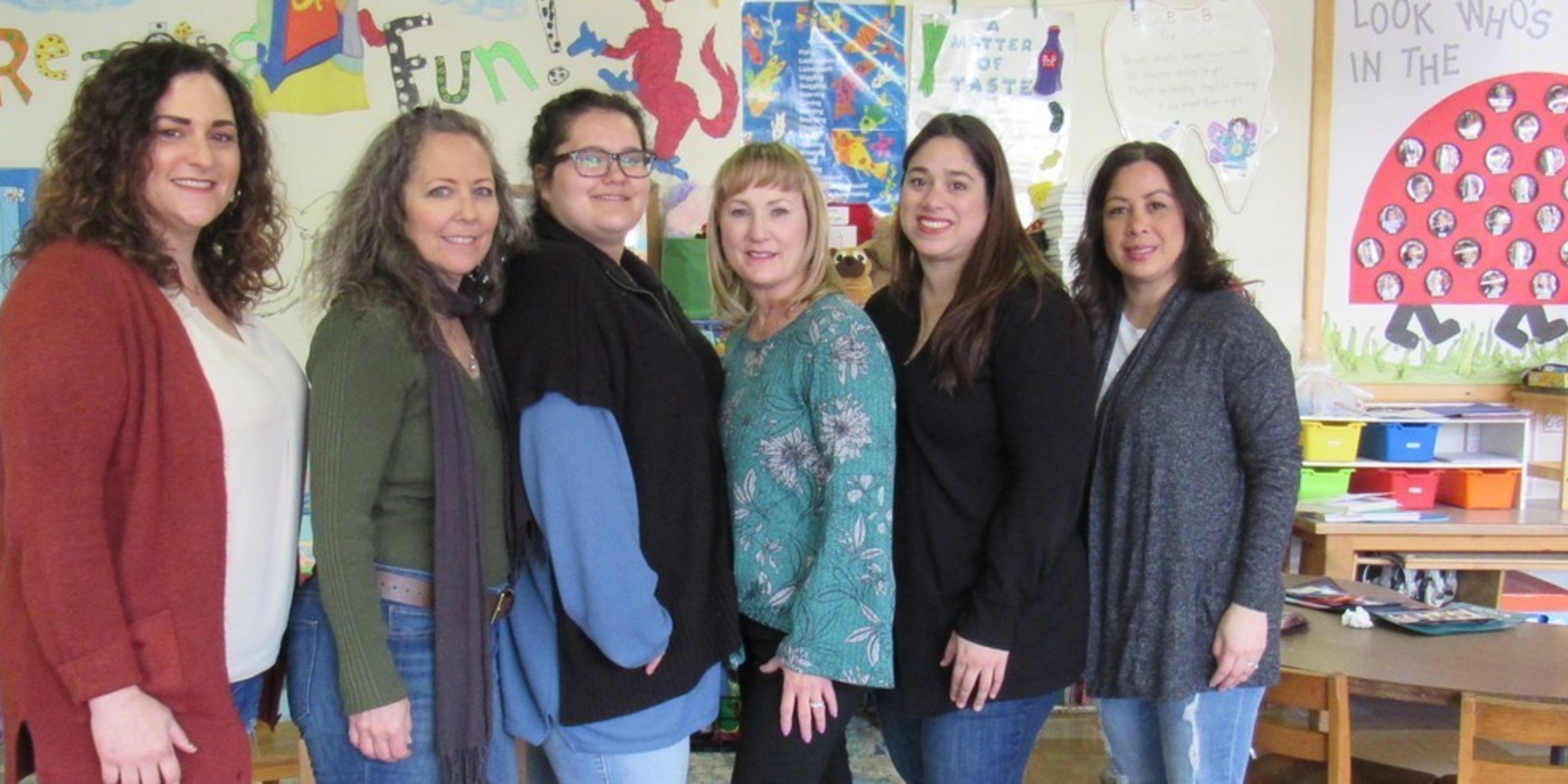 Staff Classroom Photo With Ladybug Billboard